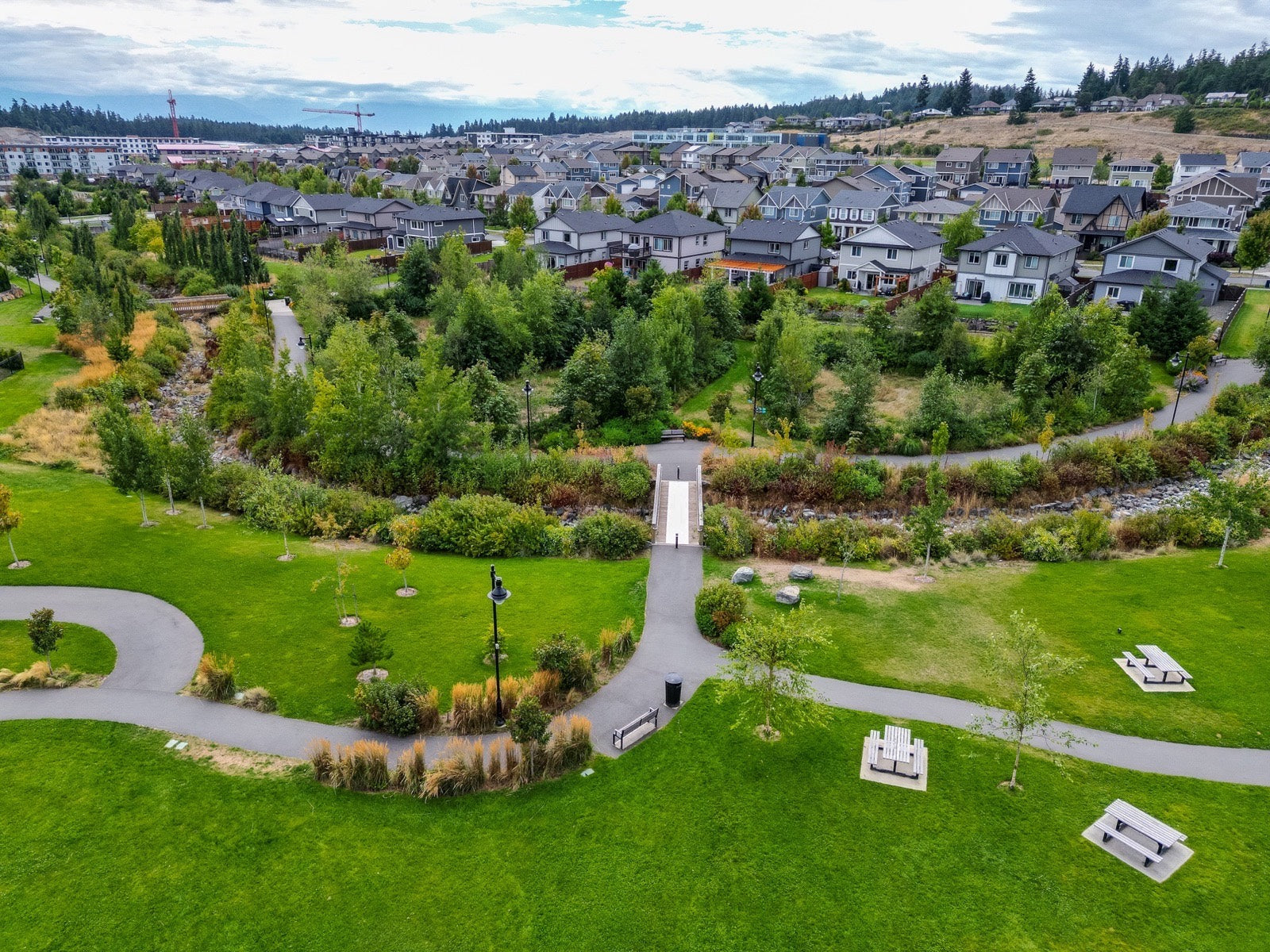Aerial view of green space, walking paths and homes in Royal Bay