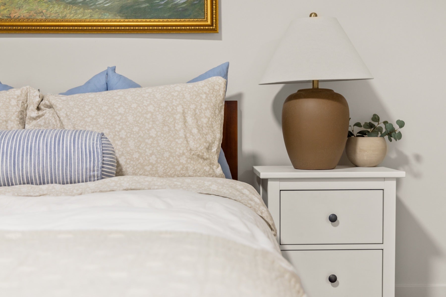 Queen bed, bedside table and lamp